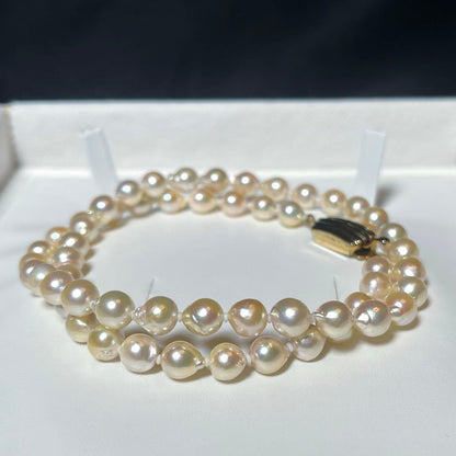 Akoya pearl semi-long necklace with round 6.6-7.0mm white pearls and silver coil clasp, 46cm length