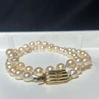 Akoya pearl semi-long necklace with round 6.6-7.0mm white pearls and silver coil clasp, 46cm length
