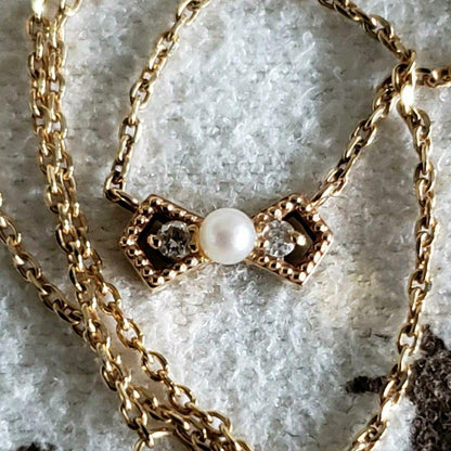 Ribbon Diamond Pearl Necklace featuring two diamonds and one pearl on an adjustable 40 cm K10 gold chain