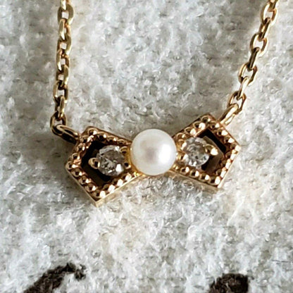 Ribbon Diamond Pearl Necklace featuring two diamonds and one pearl on an adjustable 40 cm K10 gold chain
