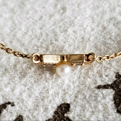 Ribbon Diamond Pearl Necklace featuring two diamonds and one pearl on an adjustable 40 cm K10 gold chain