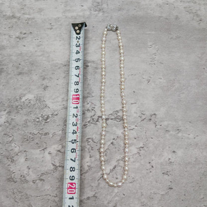 Tasaki Law Pearl Necklace featuring lustrous pearls on a 42cm chain weighing 13.8 grams