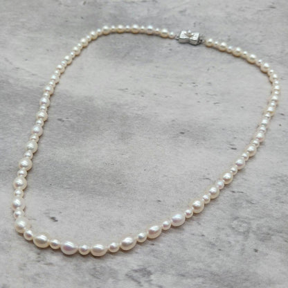 Tasaki Law Pearl Necklace featuring lustrous pearls on a 42cm chain weighing 13.8 grams