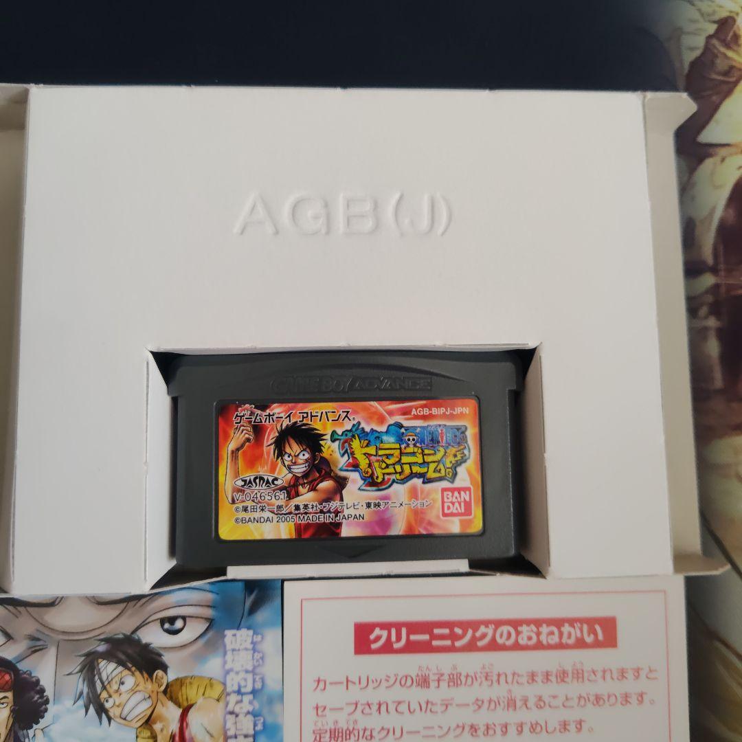 One Piece Dragon Dream First Edition card with bonus card, displayed condition showing minor scratches