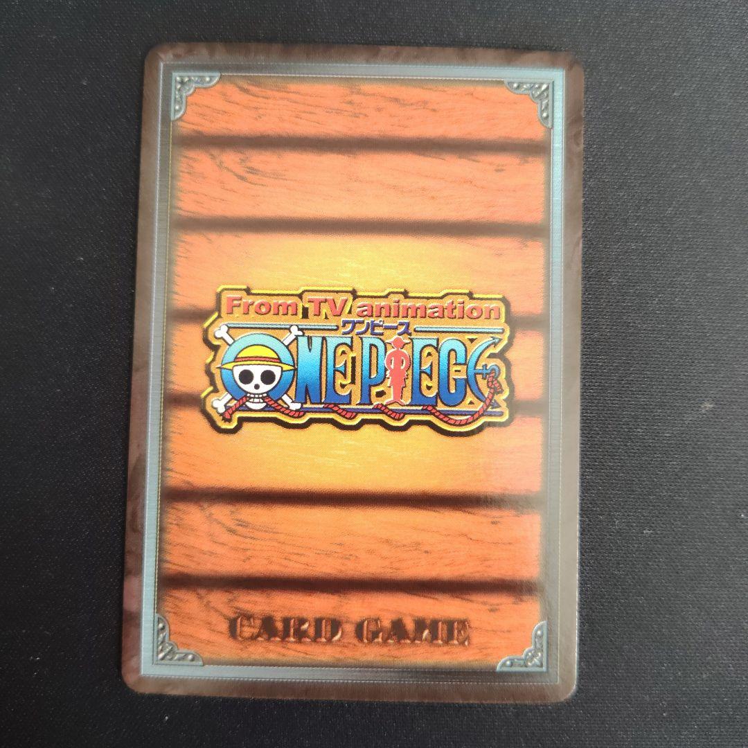 One Piece Dragon Dream First Edition card with bonus card, displayed condition showing minor scratches