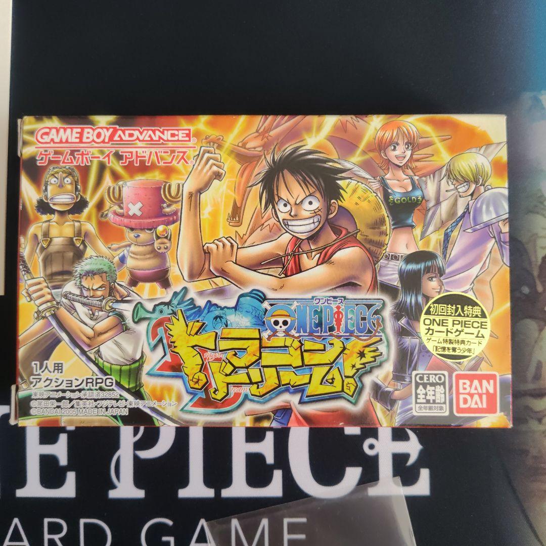 One Piece Dragon Dream First Edition card with bonus card, displayed condition showing minor scratches