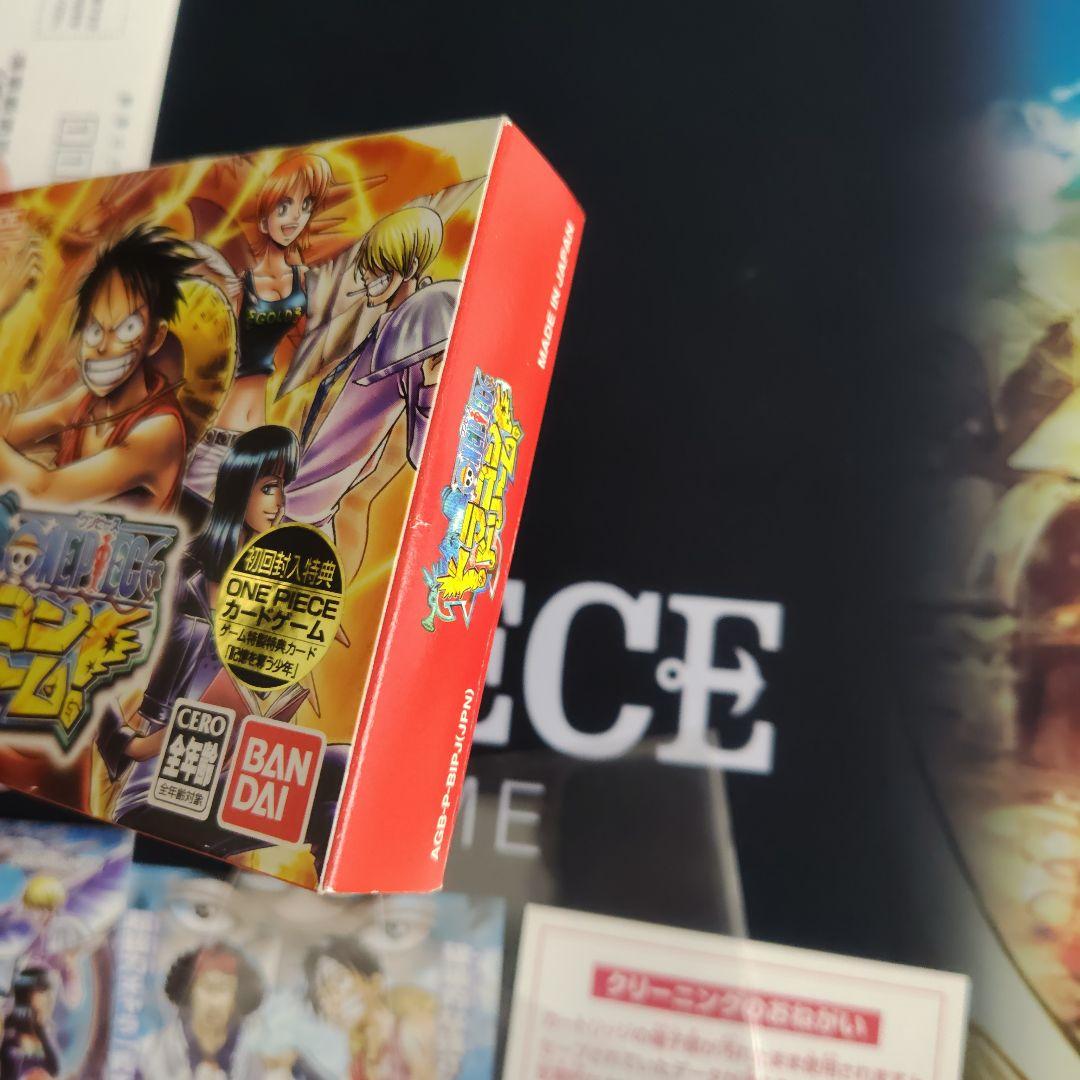 One Piece Dragon Dream First Edition card with bonus card, displayed condition showing minor scratches