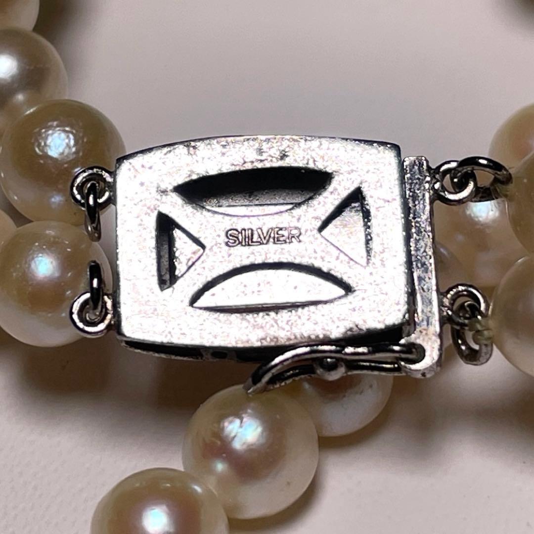 Two-row Akoya pearl necklace with 5.5-6.0mm round white pearls on silver chain model O606
