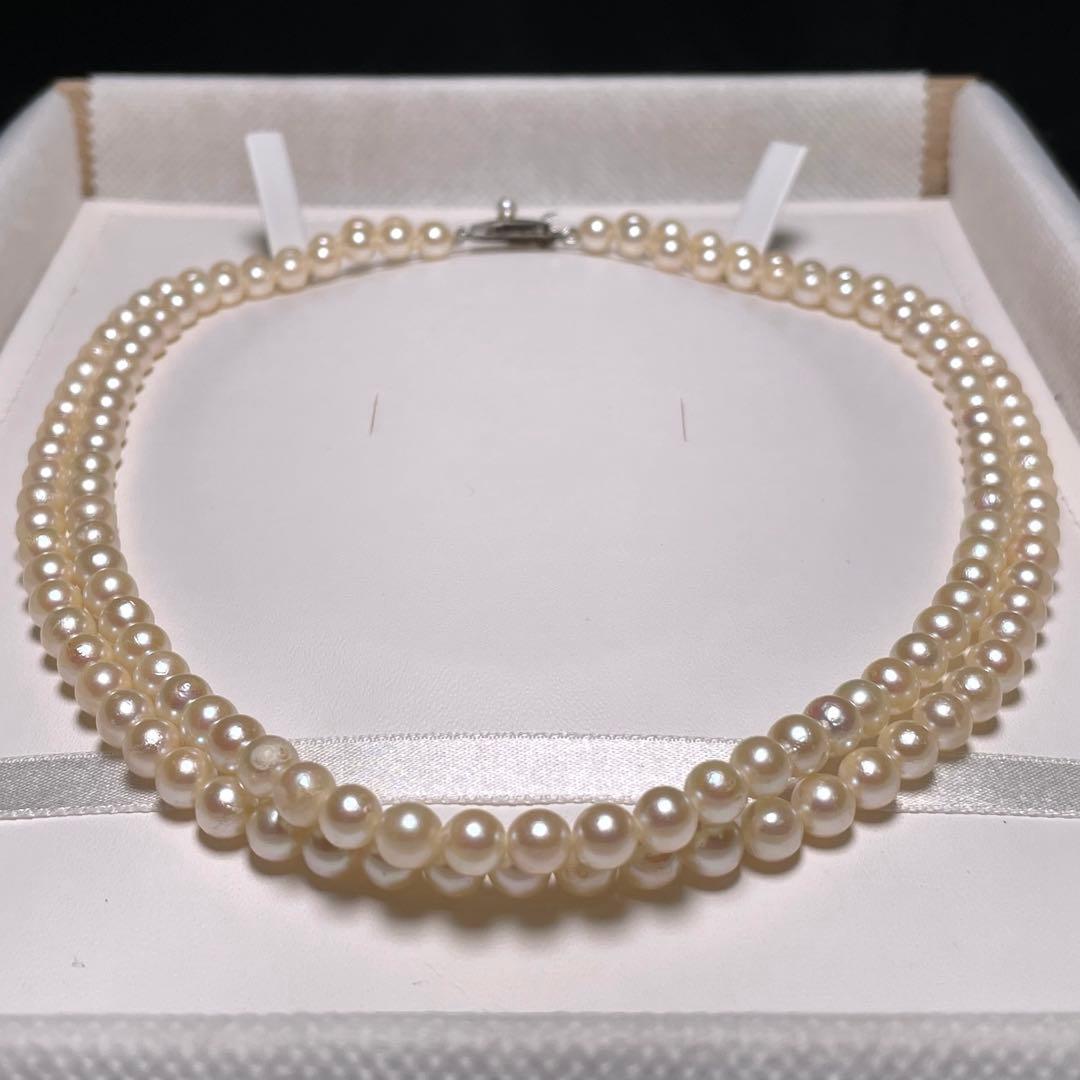 Two-row Akoya pearl necklace with 5.5-6.0mm round white pearls on silver chain model O606