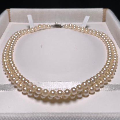 Two-row Akoya pearl necklace with 5.5-6.0mm round white pearls on silver chain model O606