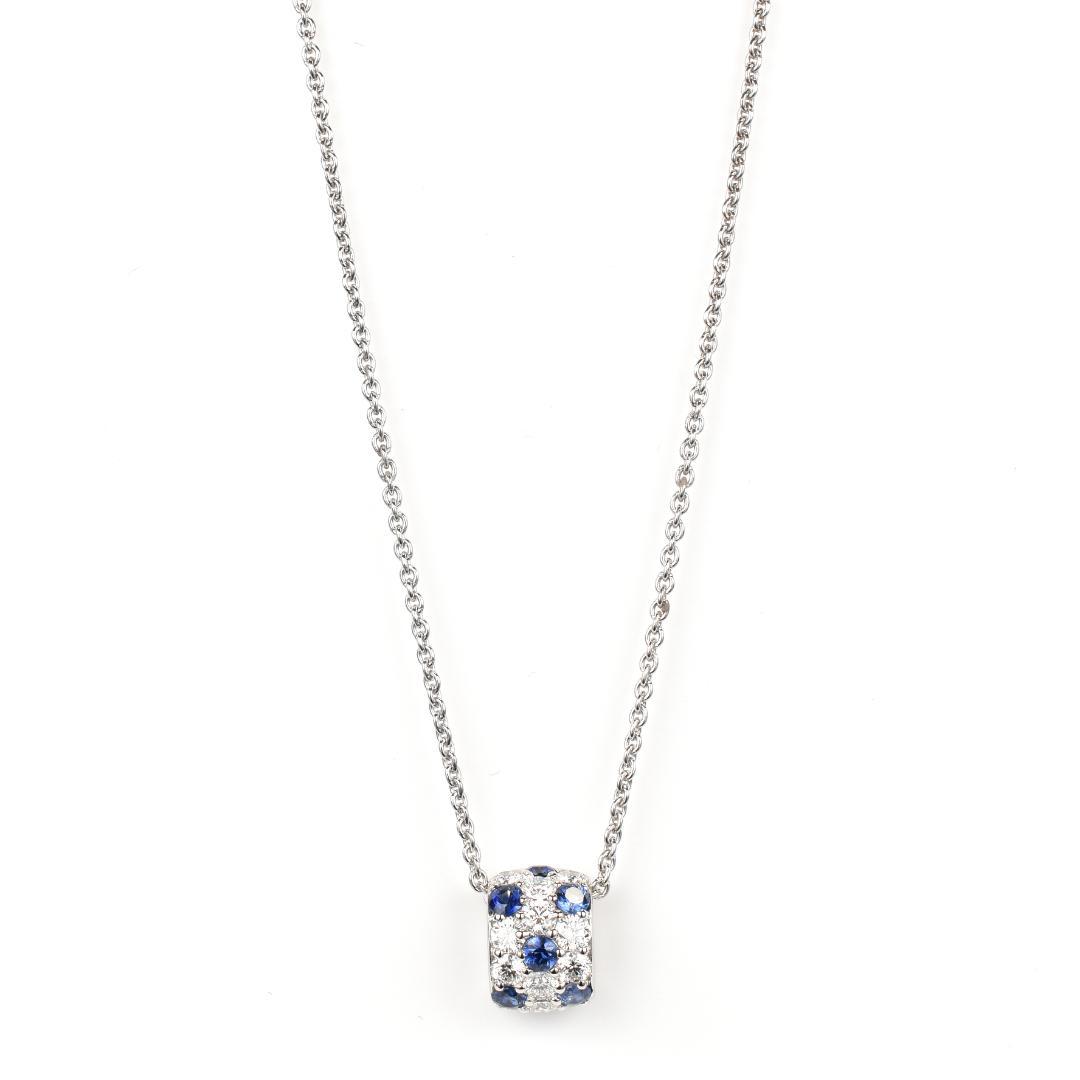 Newly restored Mikimoto white gold necklace with sapphire and diamond pendant measuring 39 cm length