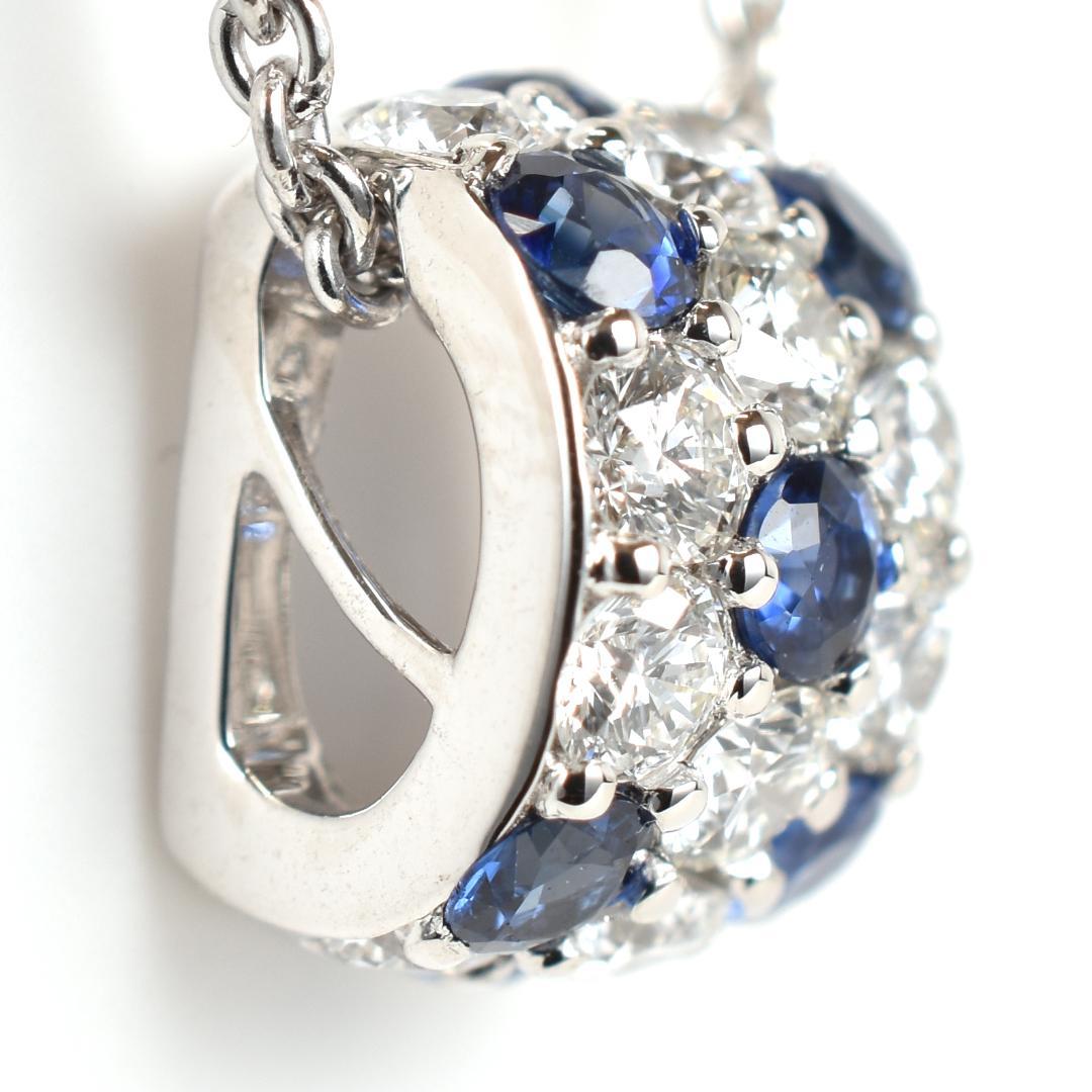 Newly restored Mikimoto white gold necklace with sapphire and diamond pendant measuring 39 cm length