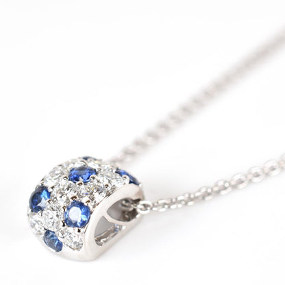 Newly restored Mikimoto white gold necklace with sapphire and diamond pendant measuring 39 cm length