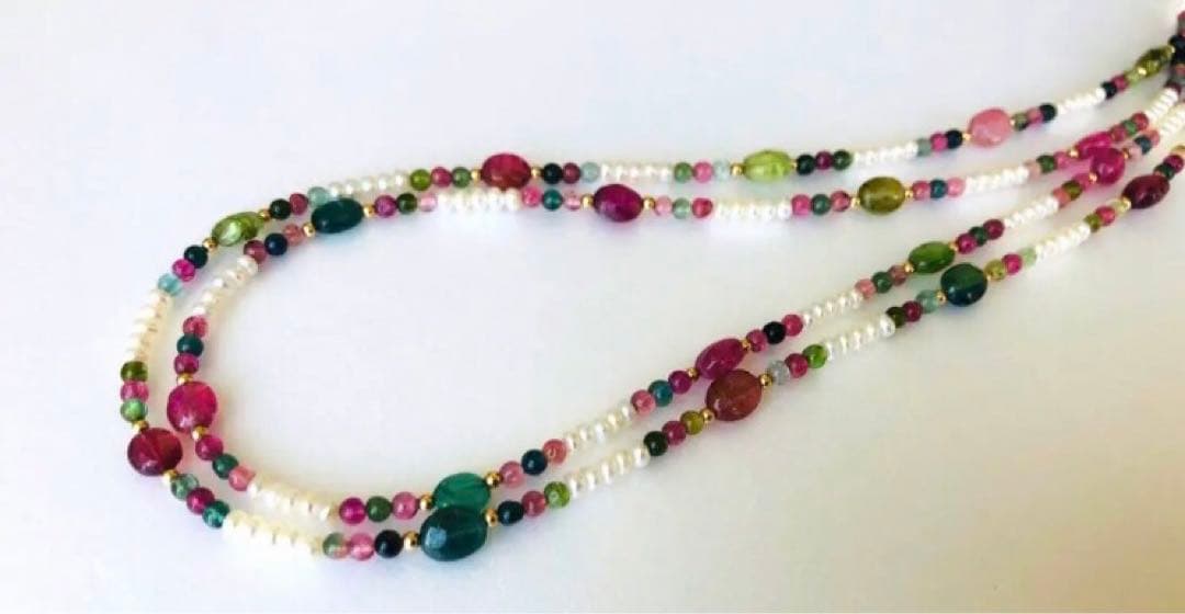 K18 2-strand gold necklace featuring 52 Akoya baby pearls and tourmaline details