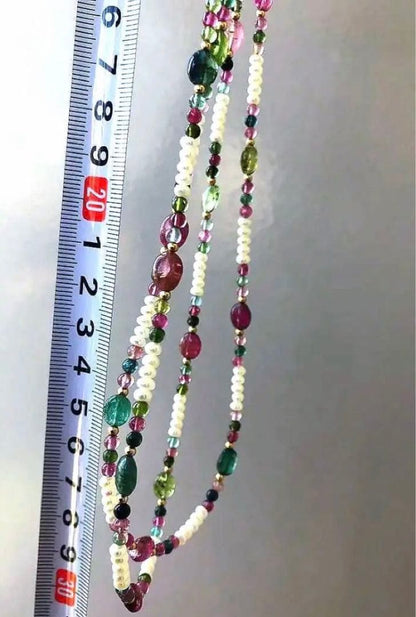 K18 2-strand gold necklace featuring 52 Akoya baby pearls and tourmaline details