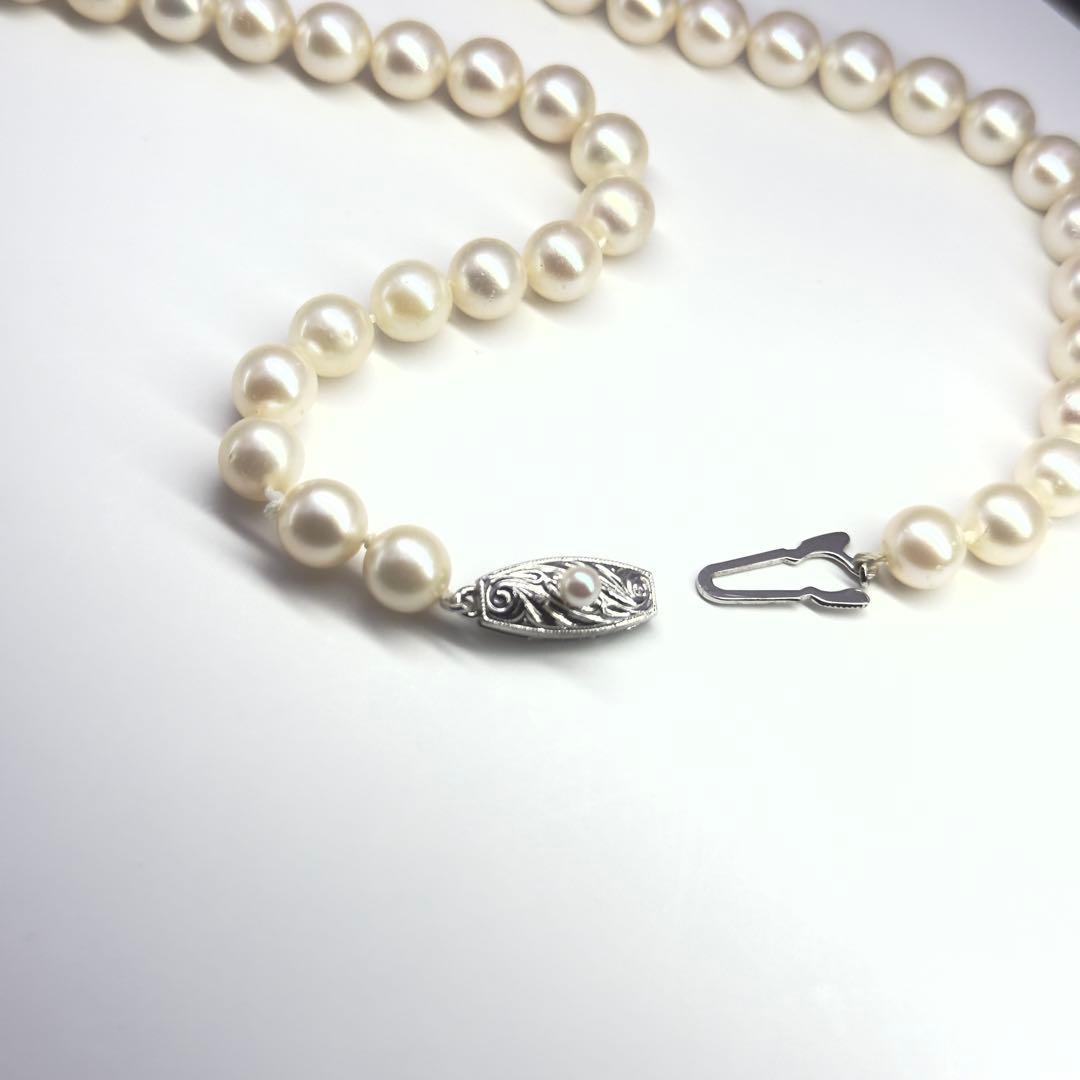 Tasaki silver necklace featuring pearls sized 6.9-7.3mm with a 43cm length