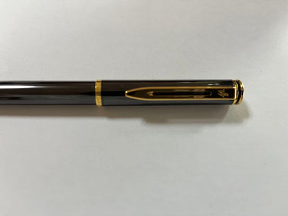 Vintage Waterman fountain pen shown with its protective case on a white background