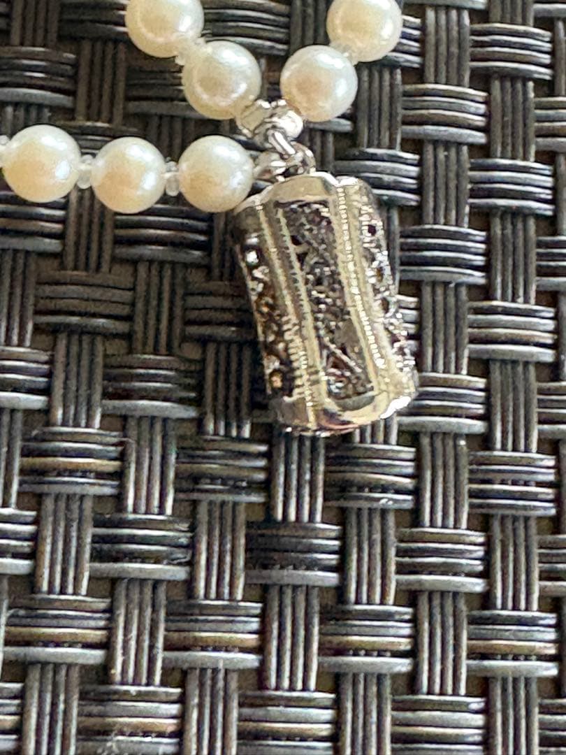 Akoya pearl necklace with three strands of varying sized white pearls, approximately 45cm long, displayed with case