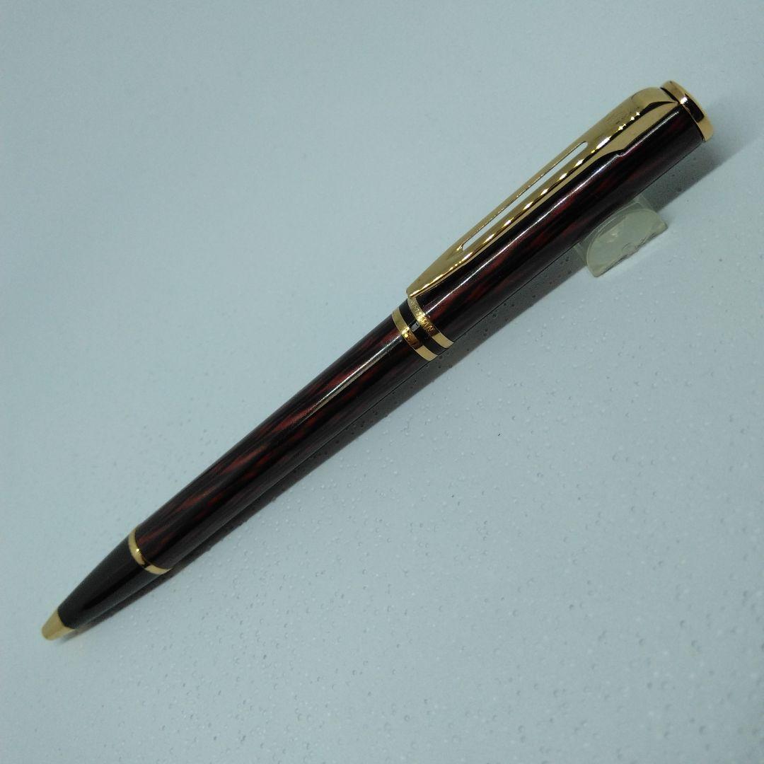 Waterman ballpoint pen in red and gold with sleek design and smooth writing tip