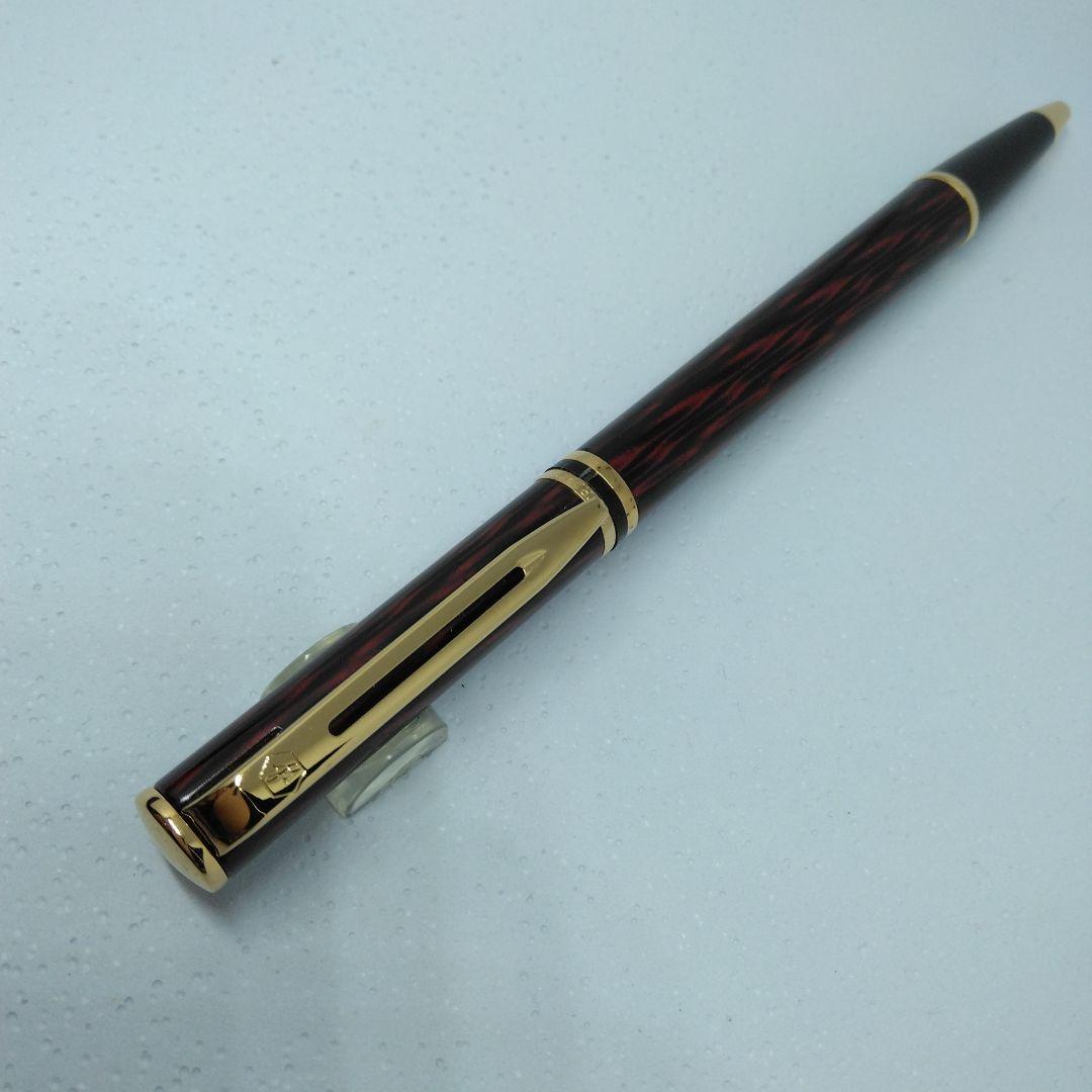 Waterman ballpoint pen in red and gold with sleek design and smooth writing tip