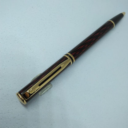 Waterman ballpoint pen in red and gold with sleek design and smooth writing tip