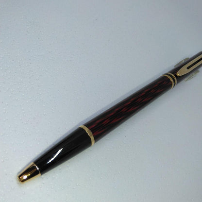 Waterman ballpoint pen in red and gold with sleek design and smooth writing tip