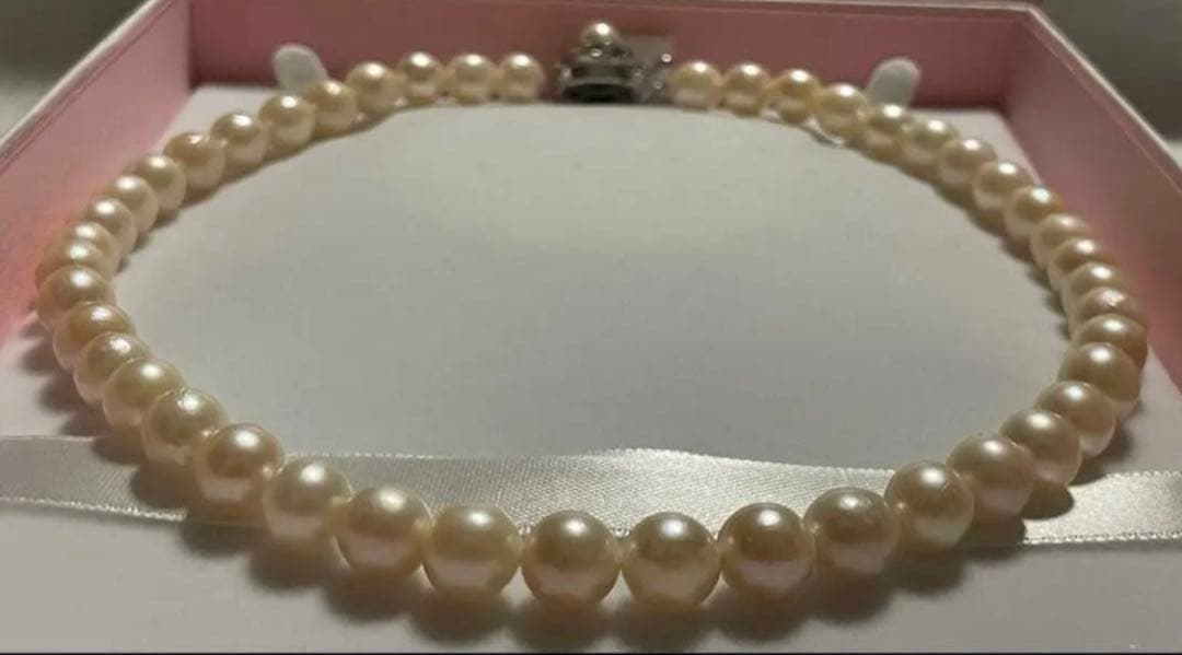Akoya Pearl Necklace with one 9mm round pearl in slight champagne gold on silver chain with double lock