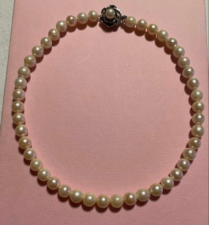 Akoya Pearl Necklace with one 9mm round pearl in slight champagne gold on silver chain with double lock