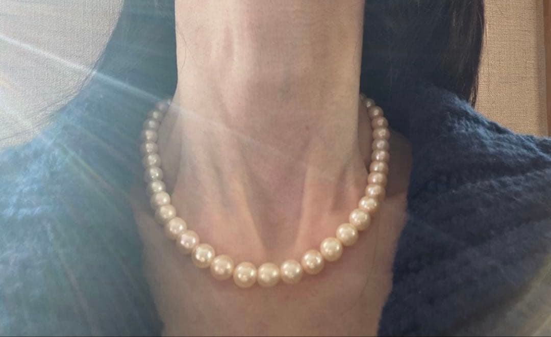 Akoya Pearl Necklace with one 9mm round pearl in slight champagne gold on silver chain with double lock
