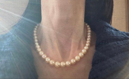 Akoya Pearl Necklace with one 9mm round pearl in slight champagne gold on silver chain with double lock