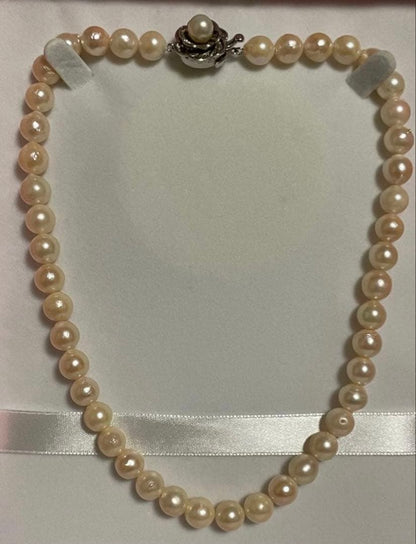 Akoya Pearl Necklace with one 9mm round pearl in slight champagne gold on silver chain with double lock