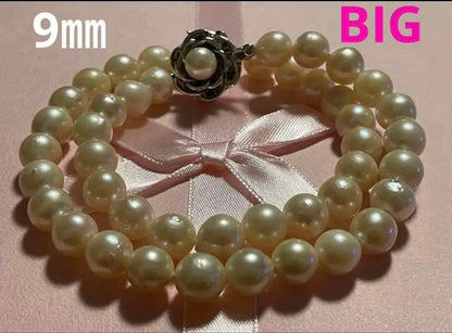 Akoya Pearl Necklace with one 9mm round pearl in slight champagne gold on silver chain with double lock