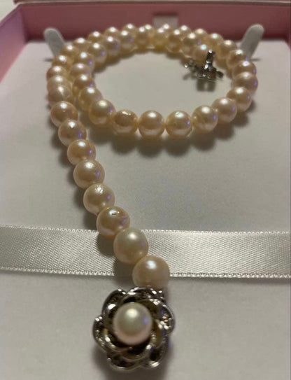 Akoya Pearl Necklace with one 9mm round pearl in slight champagne gold on silver chain with double lock