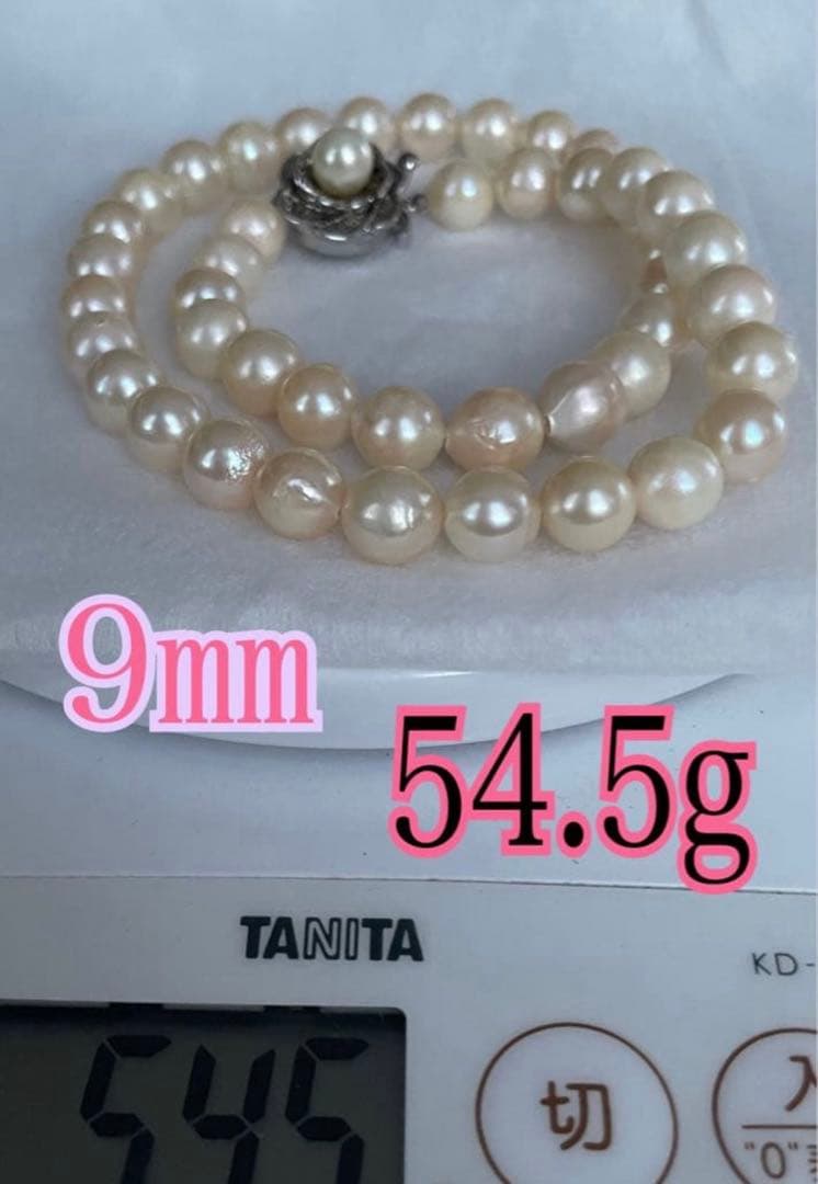 Akoya Pearl Necklace with one 9mm round pearl in slight champagne gold on silver chain with double lock