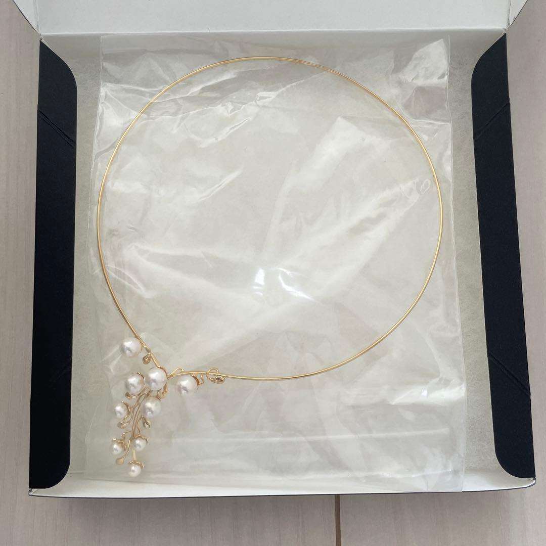 Akoya pearl omega necklace with 5mm-7mm white pearls on a 42cm chain displayed on a white background