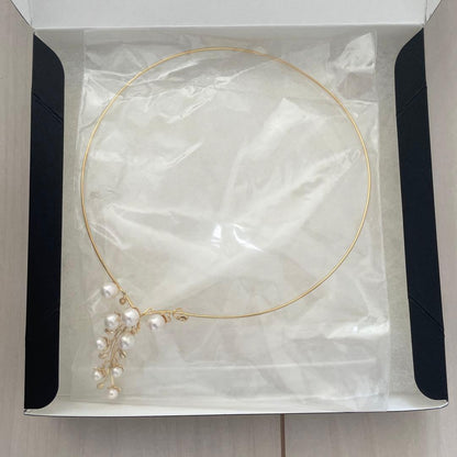 Akoya pearl omega necklace with 5mm-7mm white pearls on a 42cm chain displayed on a white background