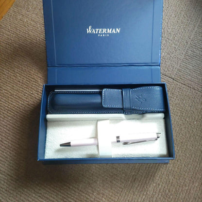 WATERMAN ballpoint pen with light pink body and silver trim, displayed with matching pen case