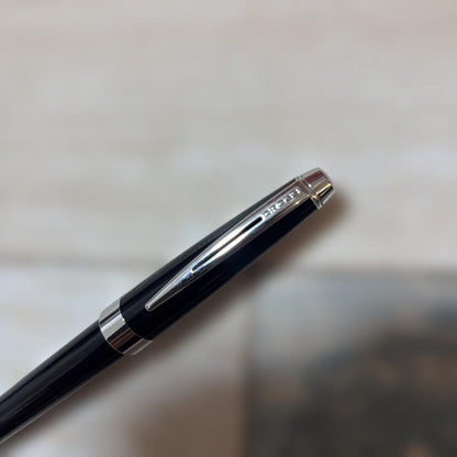 CROSS ballpoint pen with glossy black body and silver accents shown on white background