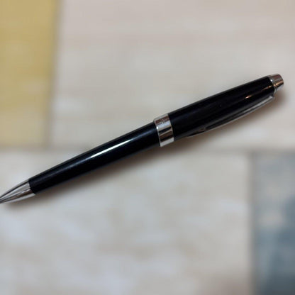 CROSS ballpoint pen with glossy black body and silver accents shown on white background