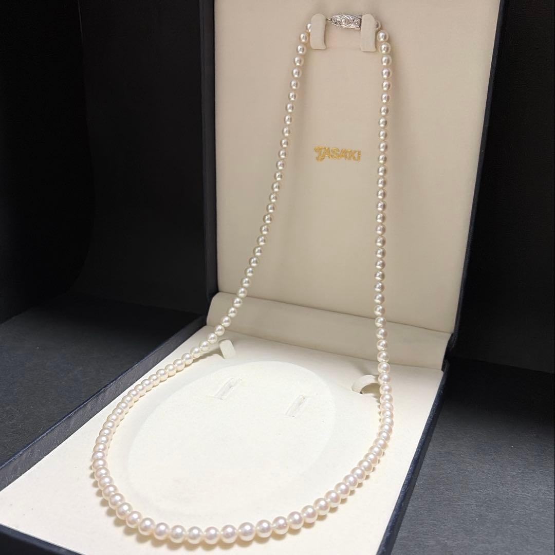 Tasaki Akoya pearl long necklace with 6.5mm genuine pearls and high luster on a white background