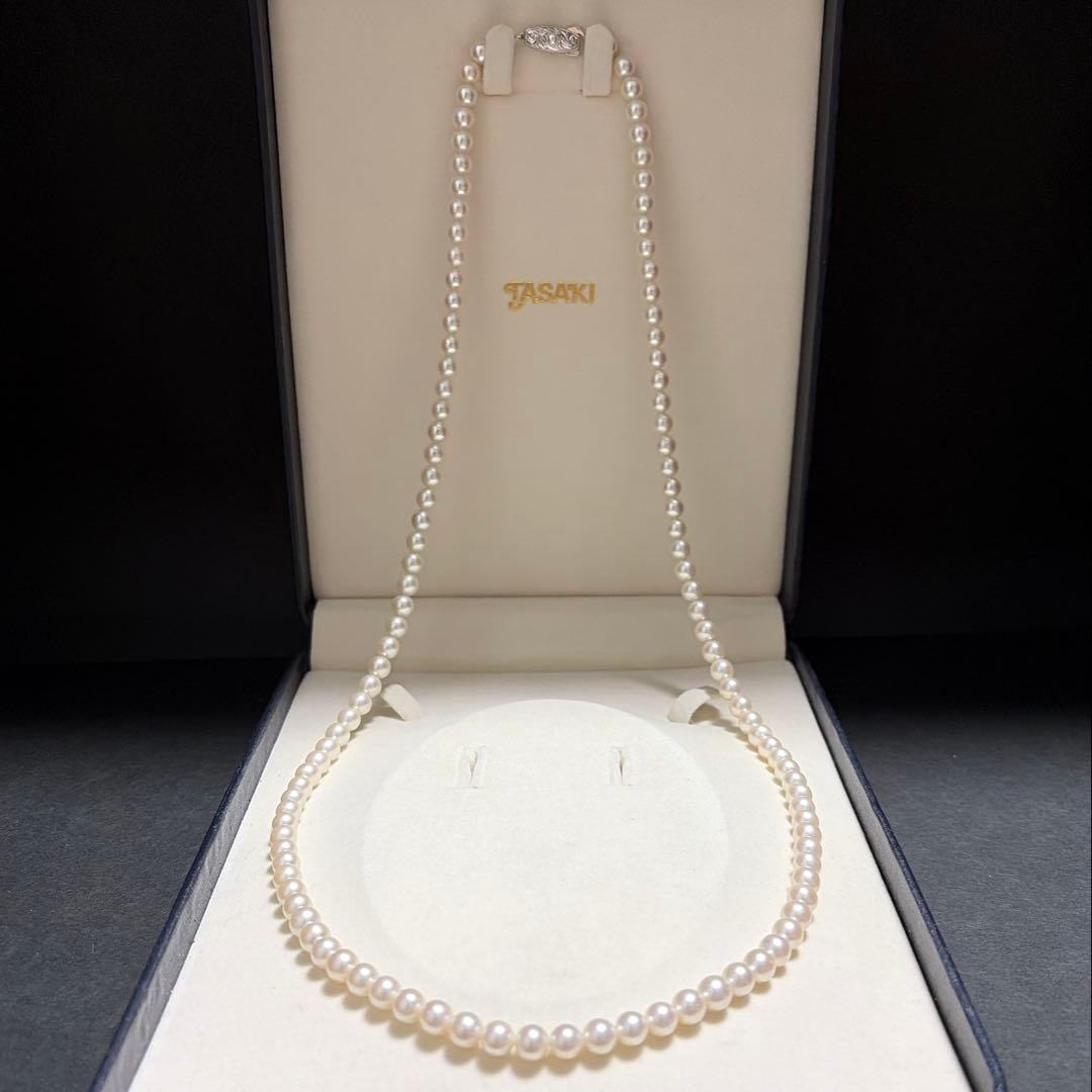 Tasaki Akoya pearl long necklace with 6.5mm genuine pearls and high luster on a white background