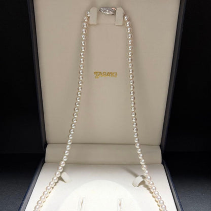 Tasaki Akoya pearl long necklace with 6.5mm genuine pearls and high luster on a white background