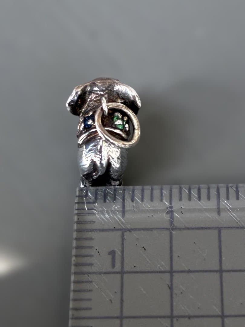Agete Elephant Pendant Top with emerald and sapphire side stones showing tarnish and black spots