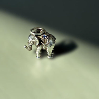 Agete Elephant Pendant Top with emerald and sapphire side stones showing tarnish and black spots