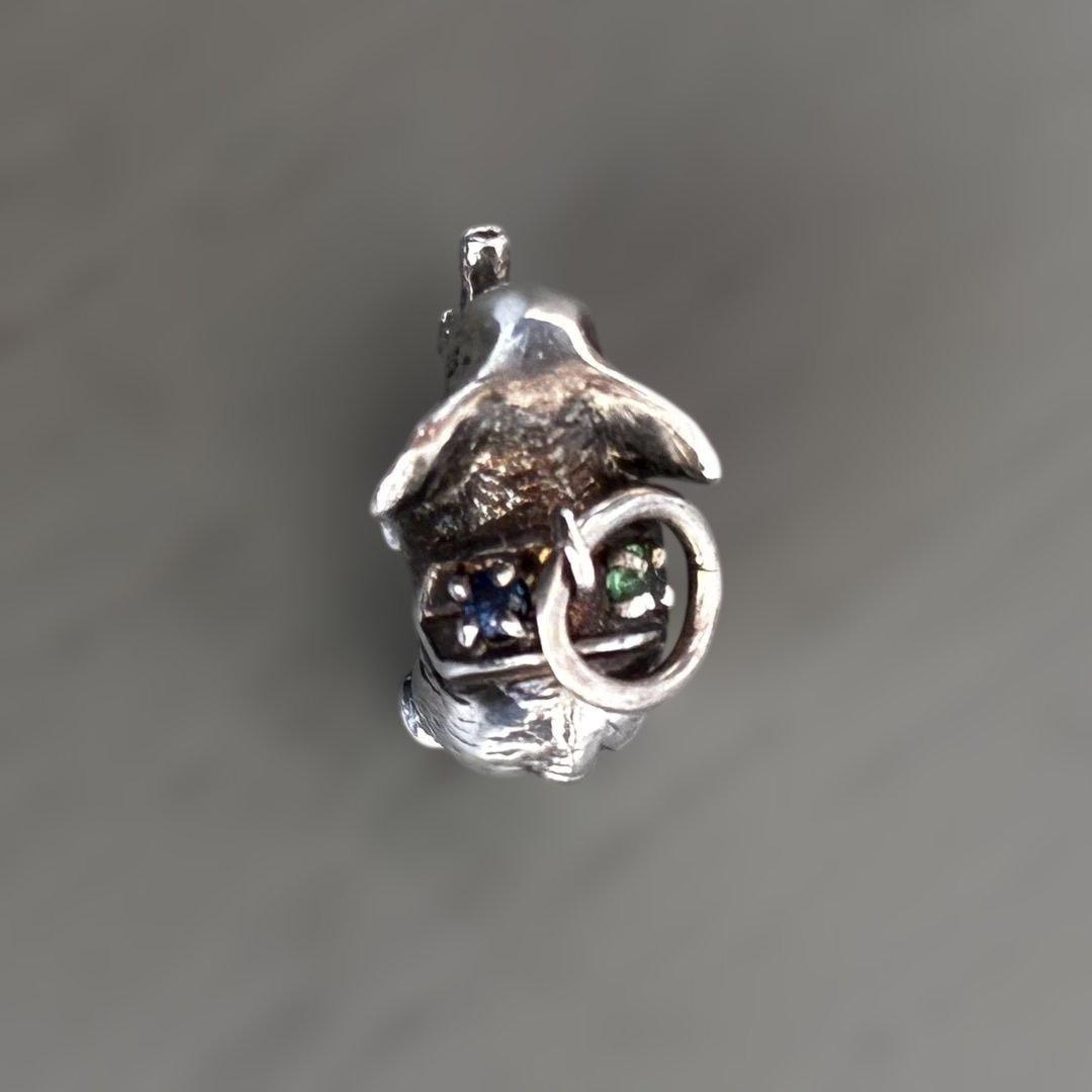 Agete Elephant Pendant Top with emerald and sapphire side stones showing tarnish and black spots