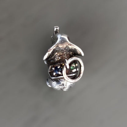 Agete Elephant Pendant Top with emerald and sapphire side stones showing tarnish and black spots