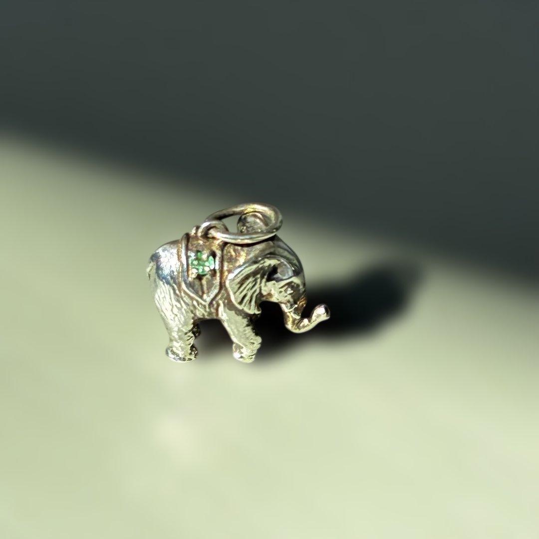 Agete Elephant Pendant Top with emerald and sapphire side stones showing tarnish and black spots