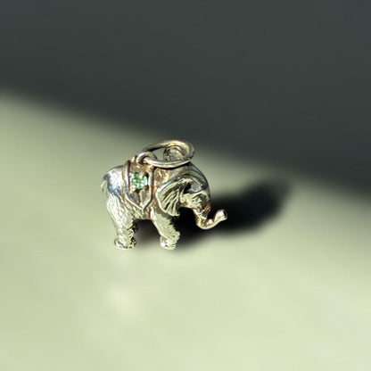 Agete Elephant Pendant Top with emerald and sapphire side stones showing tarnish and black spots