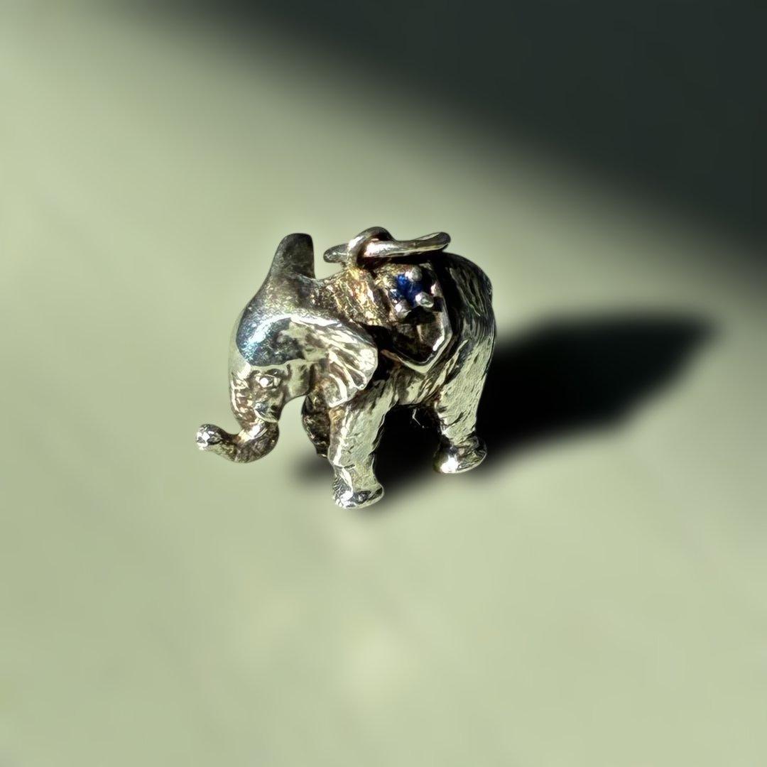 Agete Elephant Pendant Top with emerald and sapphire side stones showing tarnish and black spots