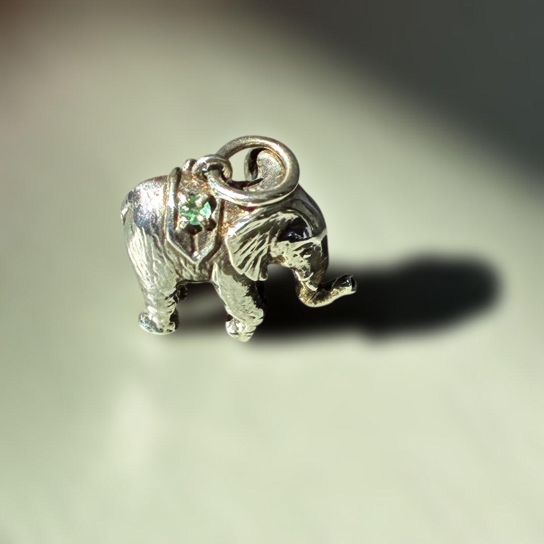 Agete Elephant Pendant Top with emerald and sapphire side stones showing tarnish and black spots